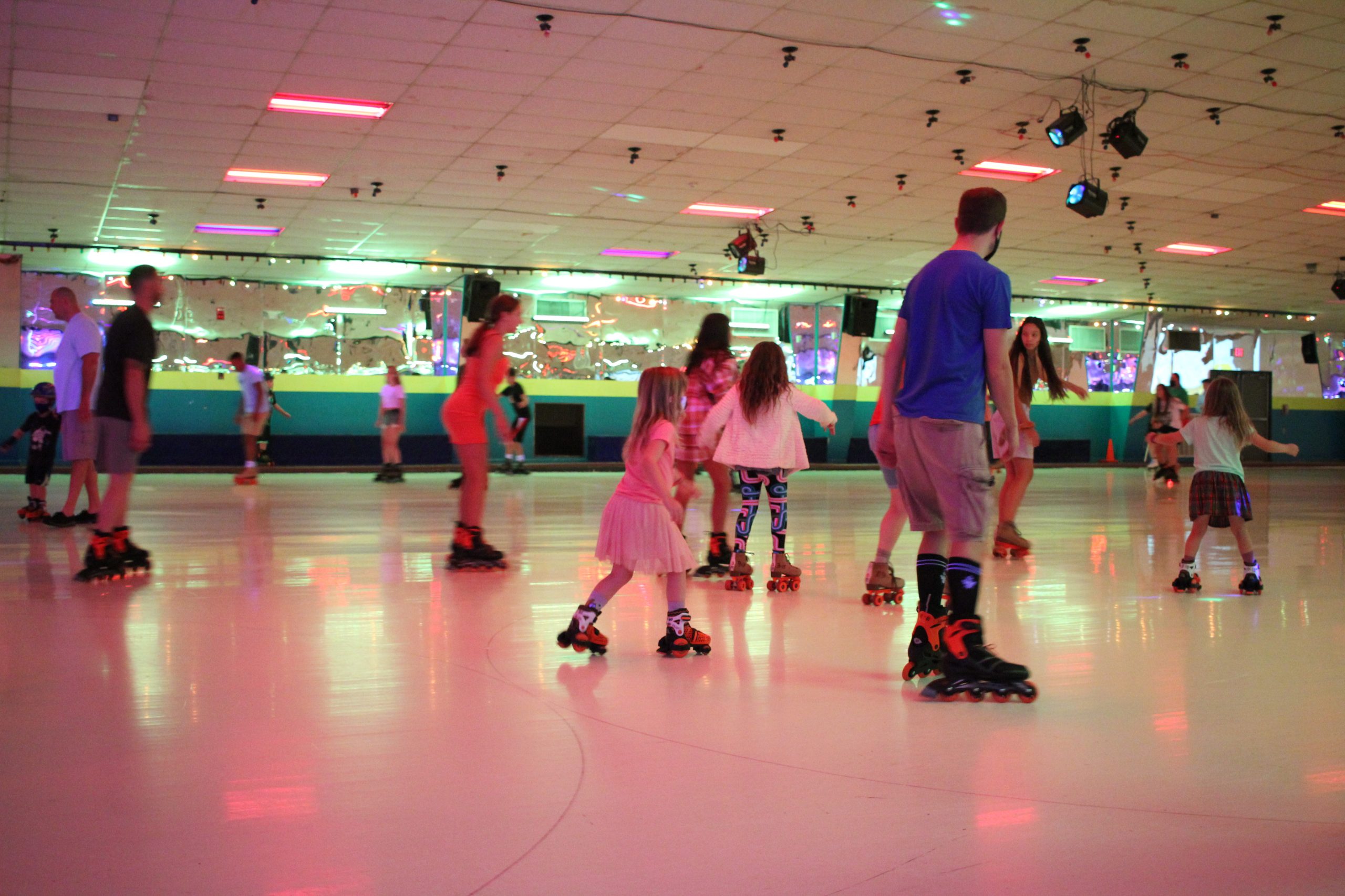 Parents with kids at roller skating enjoying free admission